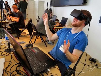 A participant at the “Reality, Virtually” hackathon held at MIT experiences virtual reality through a pair of goggles. PHOTO COURTESY SARAH PILLAI