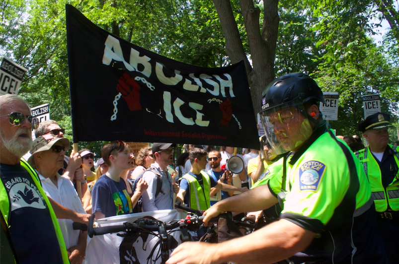 Police shield neo-Nazi counter-protesters from the crowd at the Rally Against Family Separation. PHOTO BY HANNAH SCHOENBAUM/ DAILY FREE PRESS STAFF