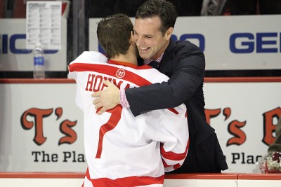 Cason Hohmann hugs head coach David Quinn during the pregame Senior Night ceremony. PHOTO BY MAYA DEVERAUX/DAILY FREE PRESS STAFF