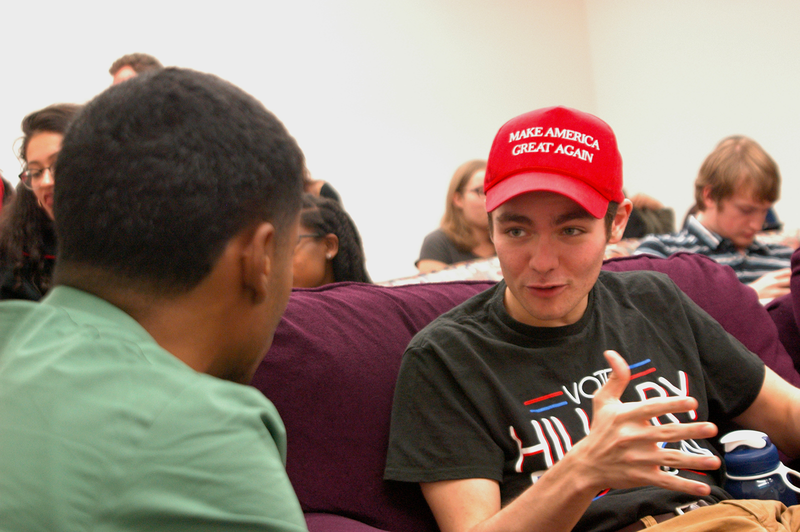 Two students exchange opinions before a viewing of the third presidential debate in the media room of 10 Buick St. Wednesday night. The debate viewing party has been a tradition for BU political science professors Dino Christenson and Douglas Kriner since 2008. PHOTO BY ALEX MASSET/ DAILY FREE PRESS STAFF