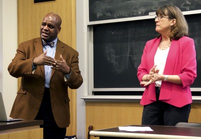 Boston University’s Dean of Students Kenneth Elmore and Title IX Coordinator Kim Randall speak during a question-and-answer session in the College of Arts and Sciences Thursday. PHOTO BY MARY SCHLICHTE/DAILY FREE PRESS STAFF