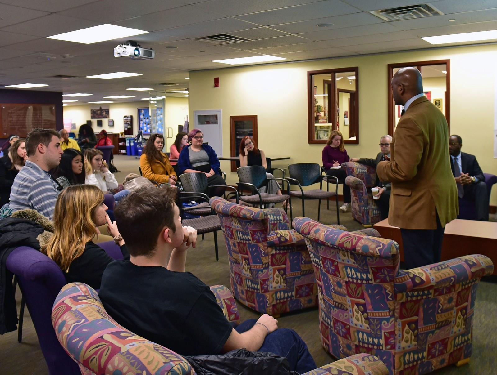 Dean of Students Kenneth Elmore speaks at a listening session held by the Task Force on Faculty Diversity and Inclusion in the Howard Thurman Center Monday. At the session, students could voice their opinions on how to improve faculty diversity at BU. PHOTO BY MADDIE MALHOTRA/DAILY FREE PRESS STAFF