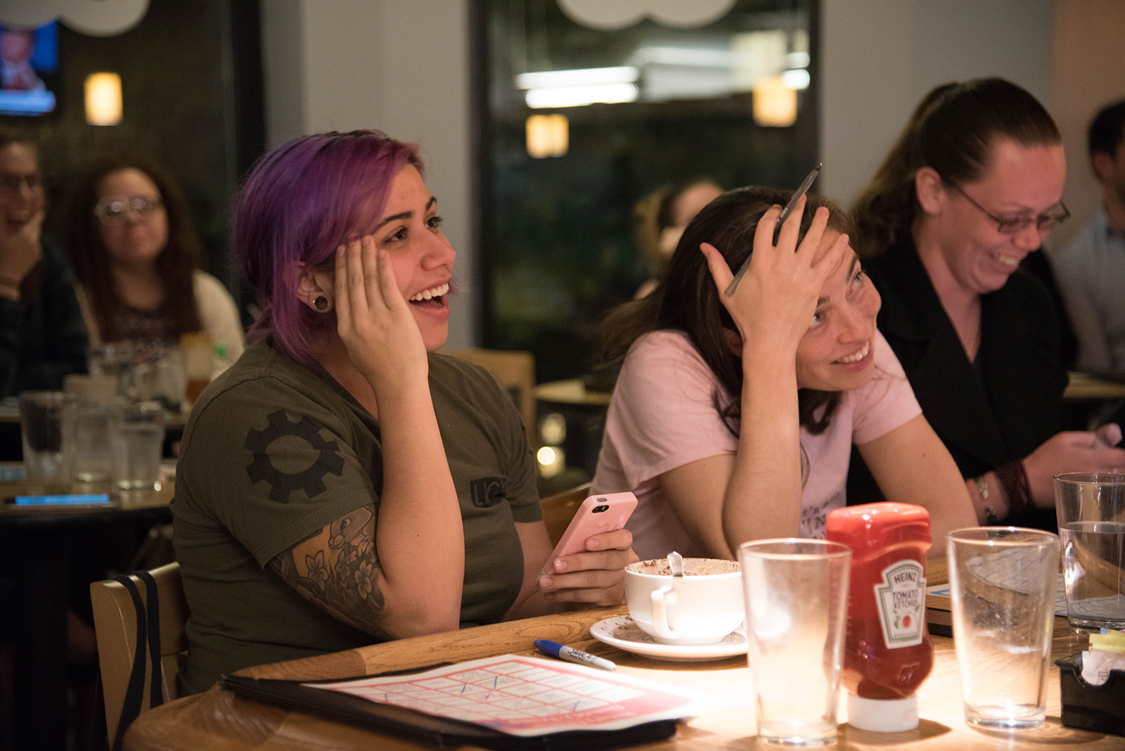 During the debate viewing at Trident Booksellers and Cafe, Erin Carey, 37, of Dorchester, sits at the bar with her friend. PHOTO BY LAUREN PETERSON/ DAILY FREE PRSS STAFF