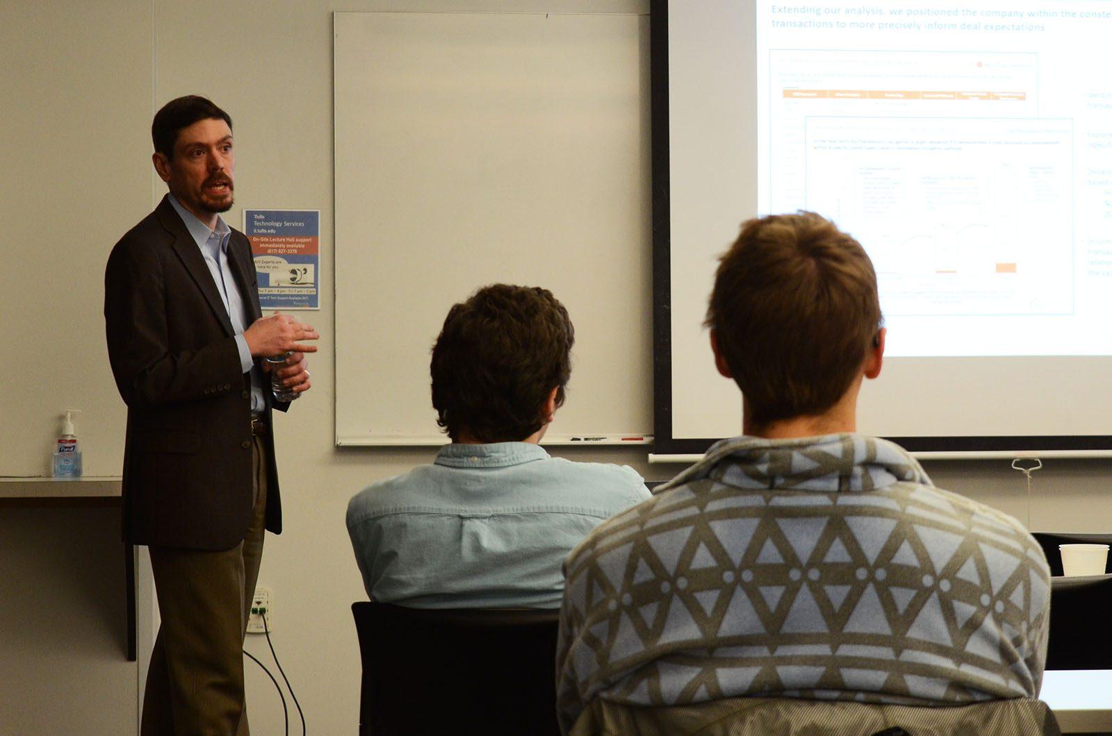 Peter Bak speaks at Tufts University at a business consulting seminar about his growth in the field of life sciences. PHOTO BY ABIGAIL FREEMAN/ DAILY FREE PRESS STAFF