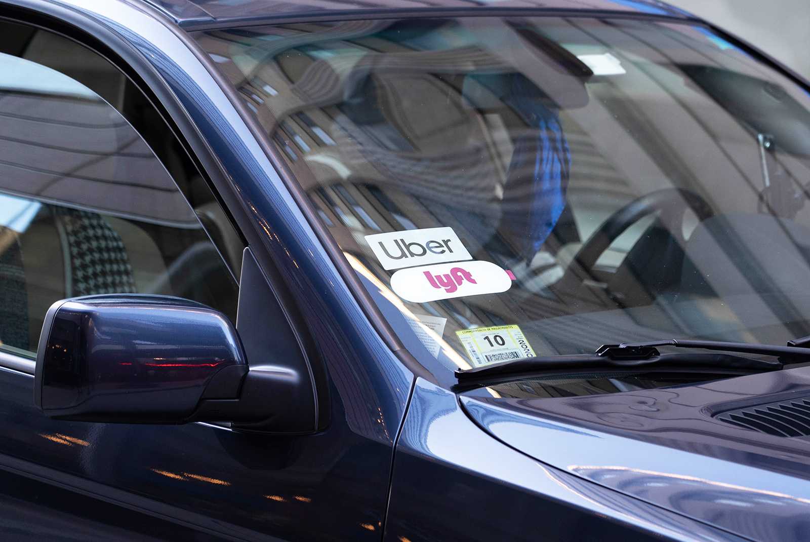 Gov. Charlie Baker proposed raising the flat fee for Uber and Lyft rides to $1 Wednesday, with plans to use the revenue for transit improvements. JASMINE LI/ DAILY FREE PRESS STAFF