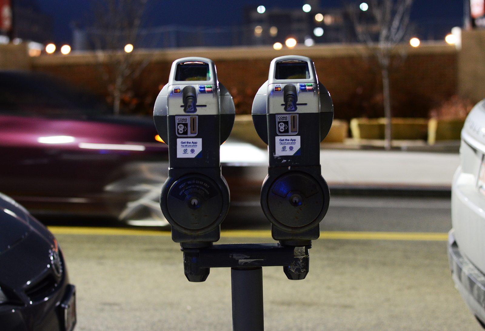 Parking meters line Babcock Street on Boston University's West Campus. Boston Mayor Martin Walsh is launching a program to examine the cost and quality of parking in the city. PHOTO BY VIGUNTHAAN THARMARAJAH/ DAILY FREE PRESS STAFF