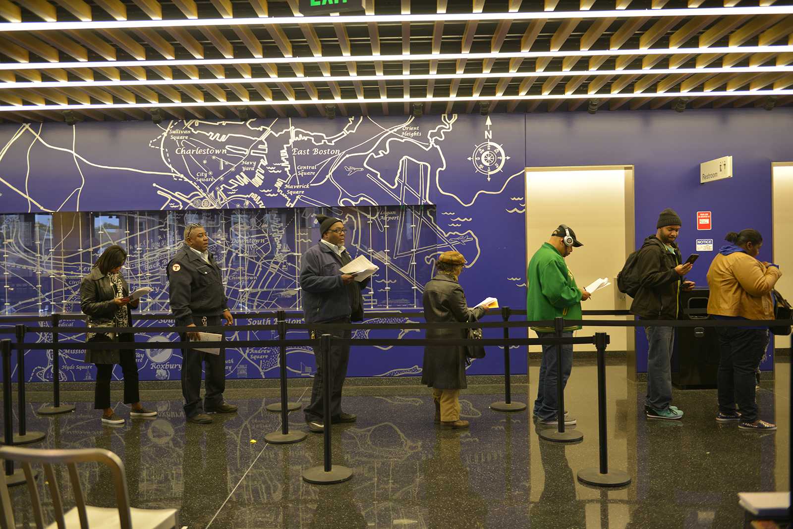 Voters wait in line to cast their votes early at the Bruce C. Bolling Municipal Building in Roxbury. PHOTO BY SHANE FU/ DAILY FREE PRESS STAFF 