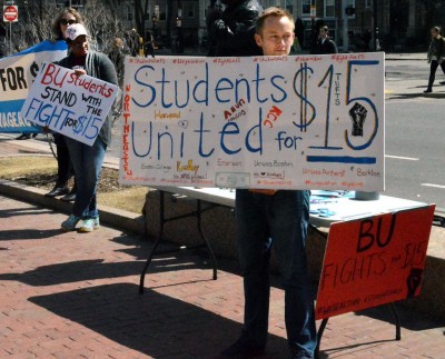 Boston University students advocate for a minimum wage of $15 in front of Marsh Chapel Tuesday. PHOTO BY ERIN BILLINGS/DAILY FREE PRESS STAFF