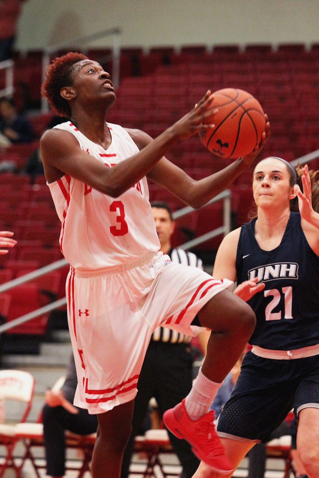 Senior forward Naiyah Thompson leaps up to make a shot during Boston University women’s basketball game against the University of New Hampshire Wednesday. MADDIE MALHOTRA/ DAILY FREE PRESS STAFF