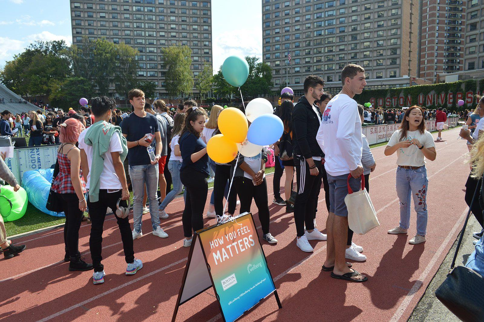 Students crowd around the Wellbeing Project table at Boston University’s Splash club fair on Sept. 7. COURTESY OF THE WELLBEING PROJECT