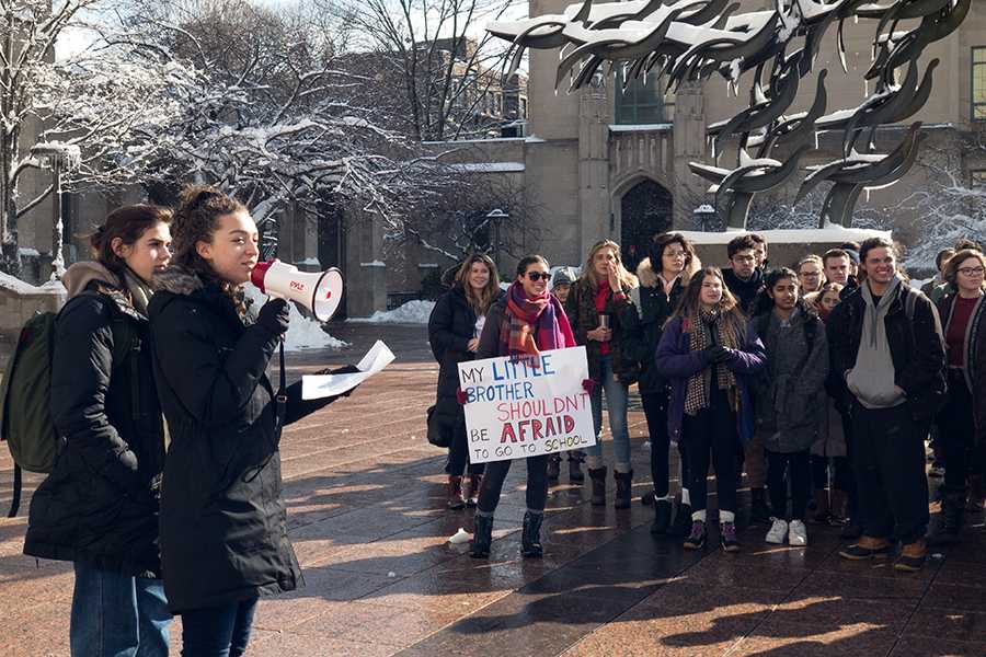 Rachel Schlueter and Shawna James speak at the BU walkout on Marsh Plaza Wednesday morning. PHOTO BY DENGFENG YANG/ DAILY FREE PRESS STAFF
