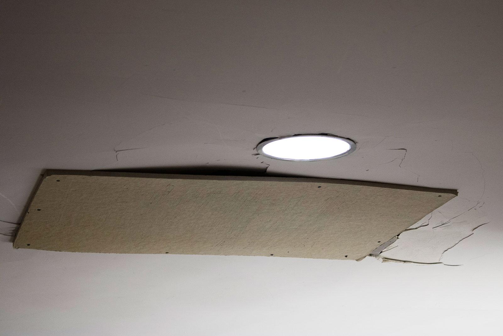 An employee carrying a ladder up the first floor escalator in Warren Towers damaged the ceiling, which has been temporarily patched up. LUWA YIN/ DAILY FREE PRESS STAFF