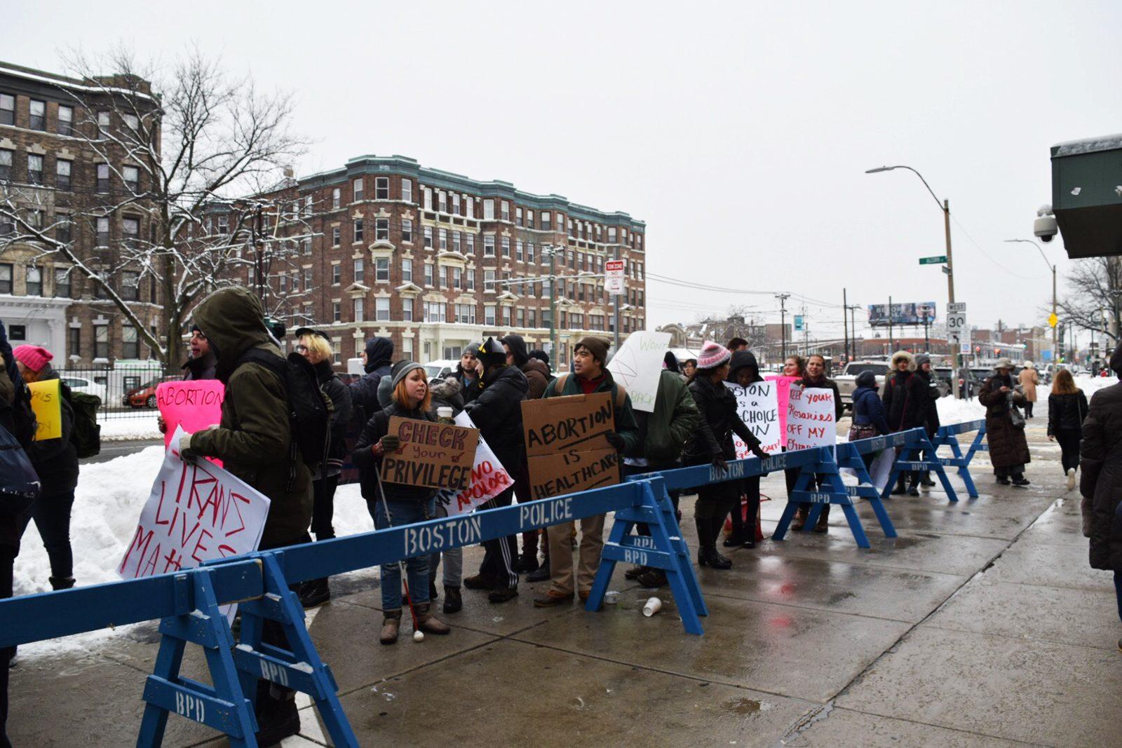Pro-choice and pro-life protesters rally in front of Planned Parenthood on Commonwealth Avenue Friday morning. PHOTO BY ASHLEY GRIFFIN/ DAILY FREE PRESS STAFF