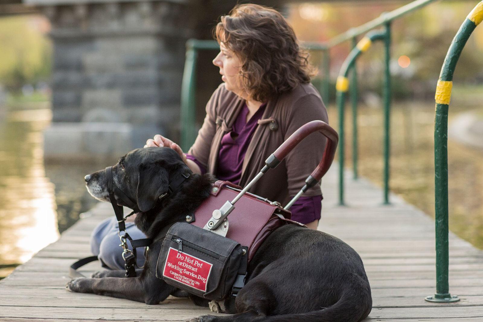 Marty Harris, who has a heart condition that makes her faint, and her service dog, Adele. PHOTO COURTESY LONG HAUL FILMS