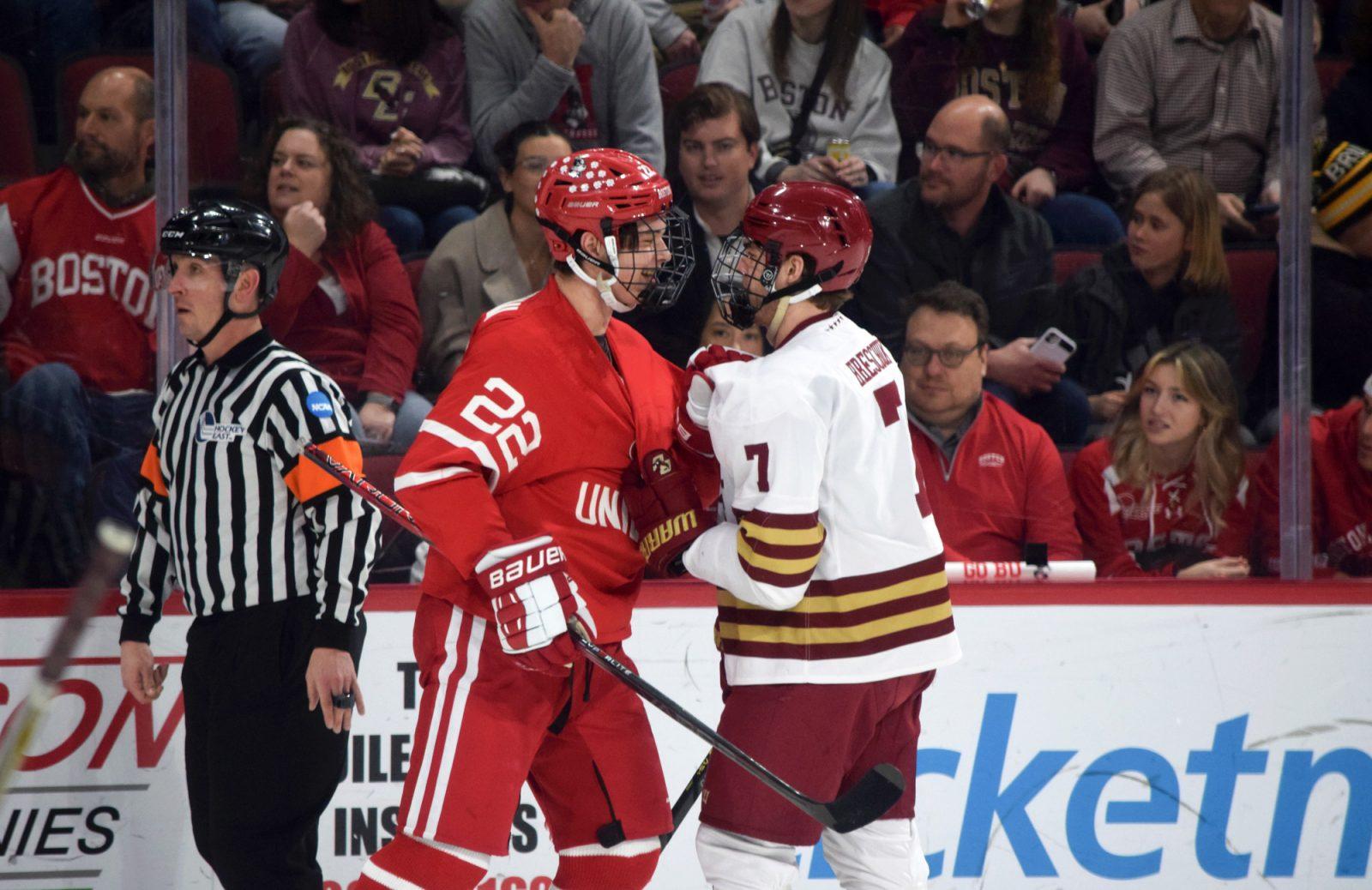 Freshman defender Aiden Celebrini (22) and junior Aidan Hreschuk (7) taunt each other in a rivalry game at Boston University on Saturday. GRACIE DAVENPORT/BOSTON HOCKEY BLOG
