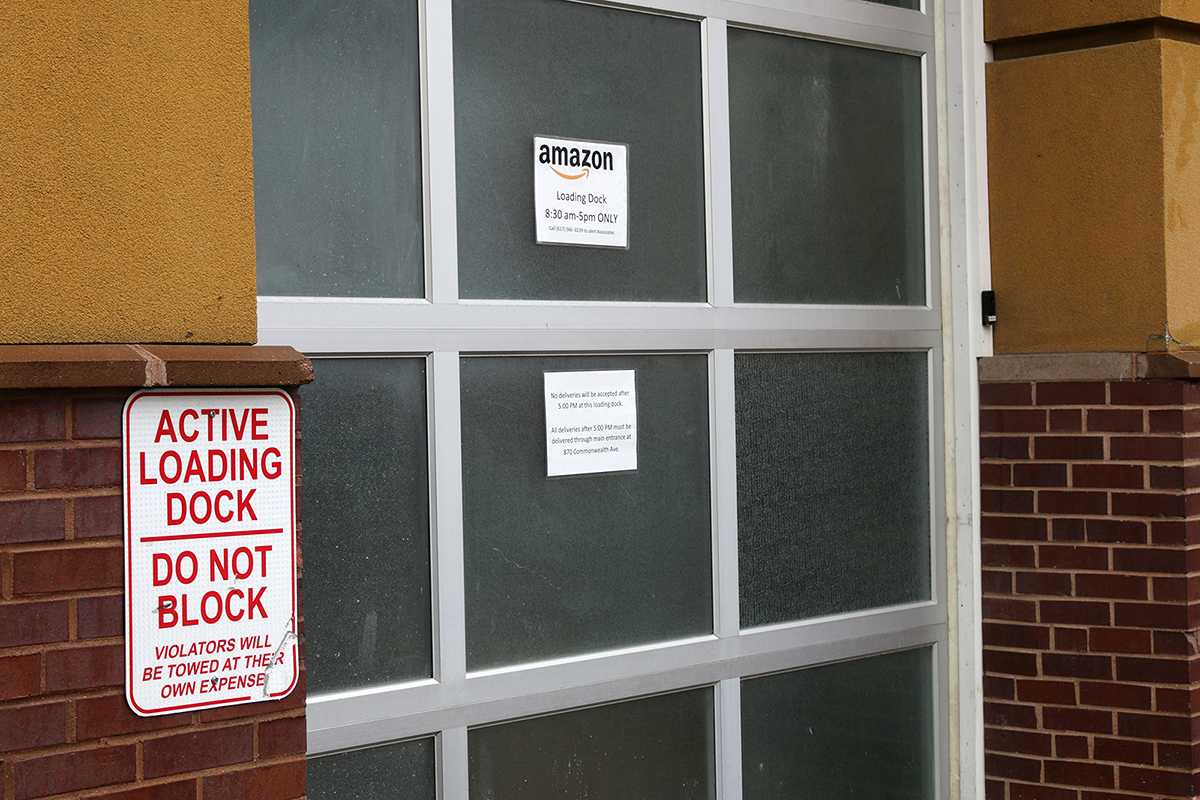 A loading dock for trucks behind an Amazon locker on Commonwealth Avenue. Six former Amazon drivers of black and Latinx descent filed a class action lawsuit alleging that Amazon had discriminated against them by firing them in 2016. GABRIELA HUTCHINGS/ DAILY FREE PRESS STAFF