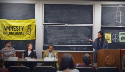 Monika Nayak, a sophomore in the College of Arts and Sciences and a member of Amnesty International at BU, speaks during a panel Wednesday night about problems within the criminal justice system in the United States. PHOTO BY NICOLAS TEPPER/DAILY FREE PRESS STAFF
