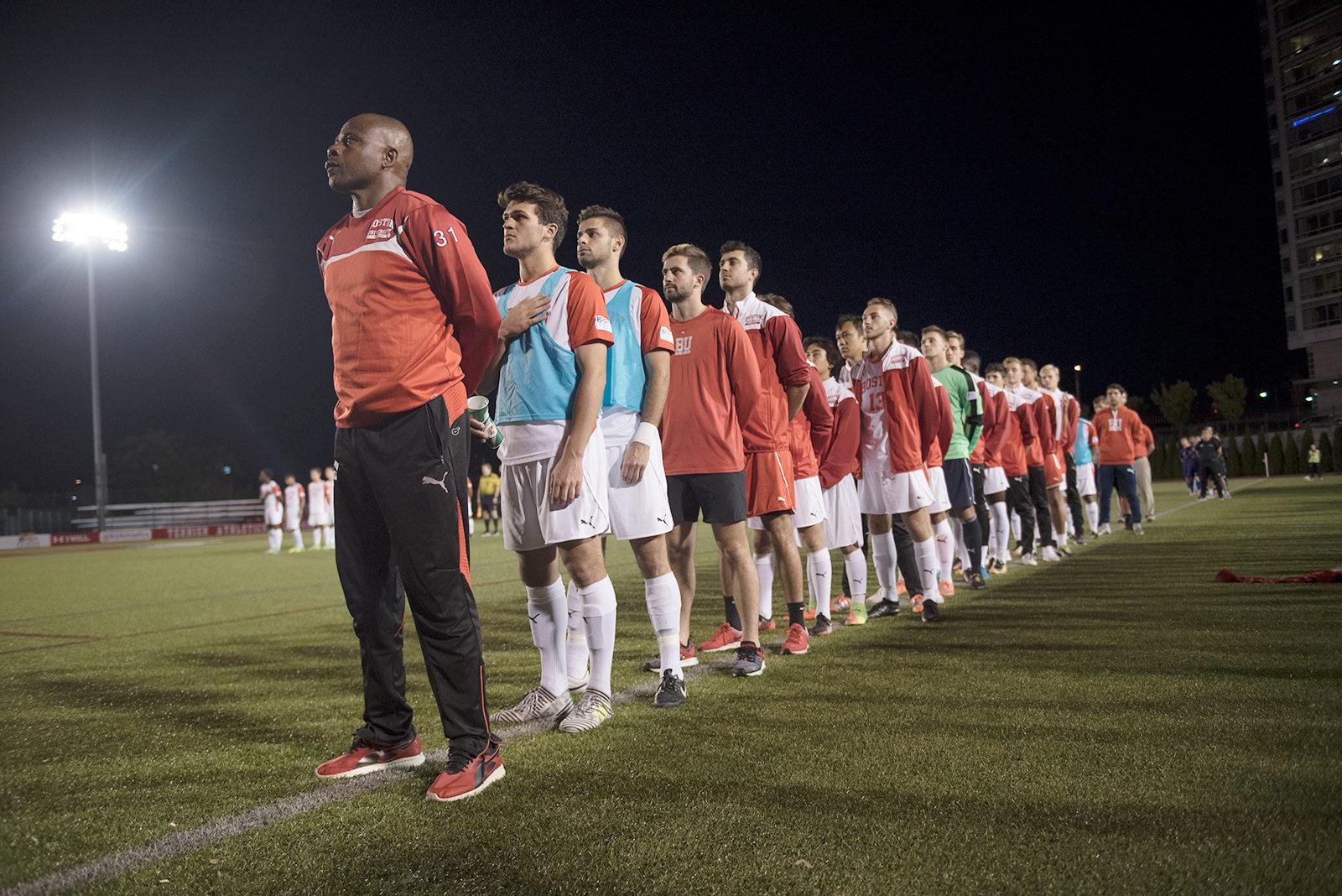 The Boston University men’s soccer team stands for the national anthem on Wednesday night. PHOTO BY MAISIE MANSFIELD-GREENWALD/ DAILY FREE PRESS STAFF
