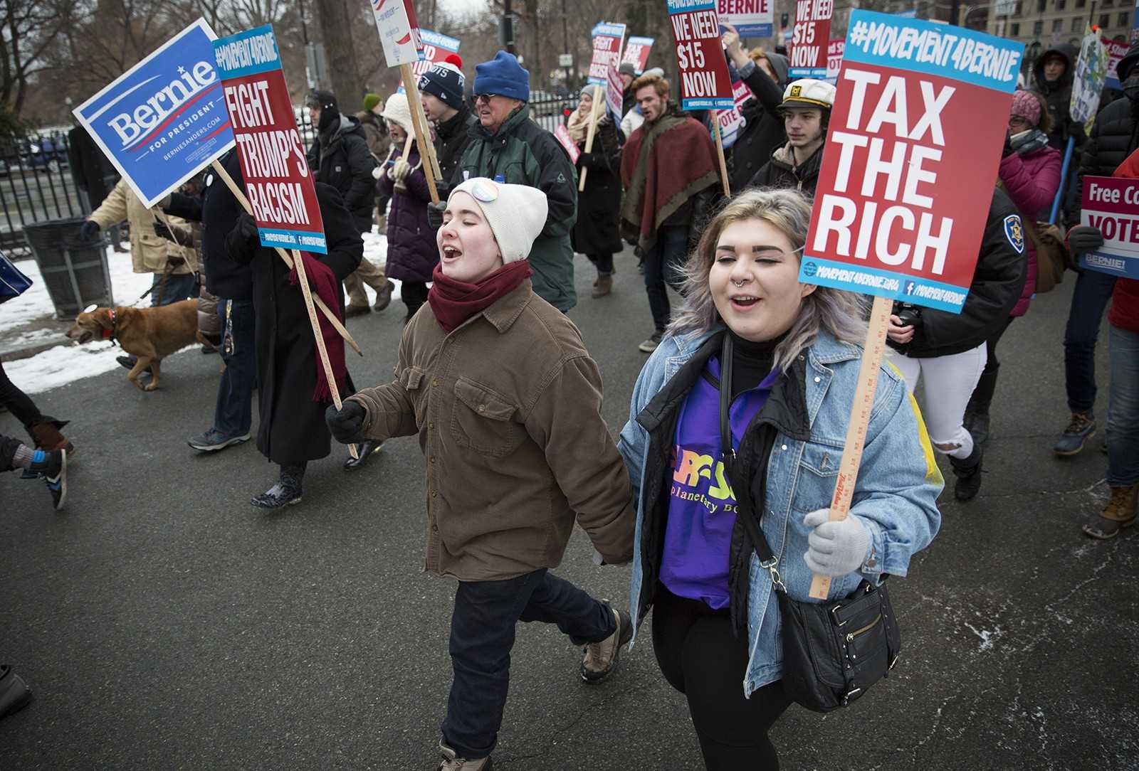 Beginning at the Boston Common bandstand, the crowd walked through the Common to the steps of the Massachusetts State House. PHOTO BY SARAH SILBIGER/DAILY FREE PRESS STAFF