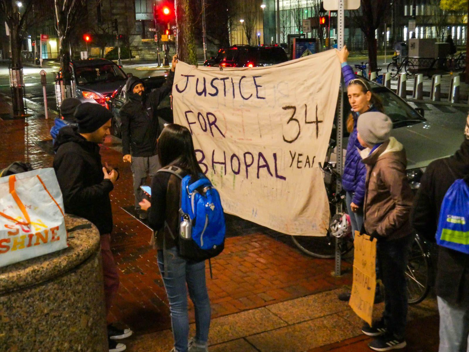 Protestors gathered Sunday at One Silber Way to protest Boston University President Robert Brown’s ties to DowDuPont Inc., the company responsible for the Bhopal, India, crisis. FELIX PHILLIPS/ DAILY FREE PRESS STAFF