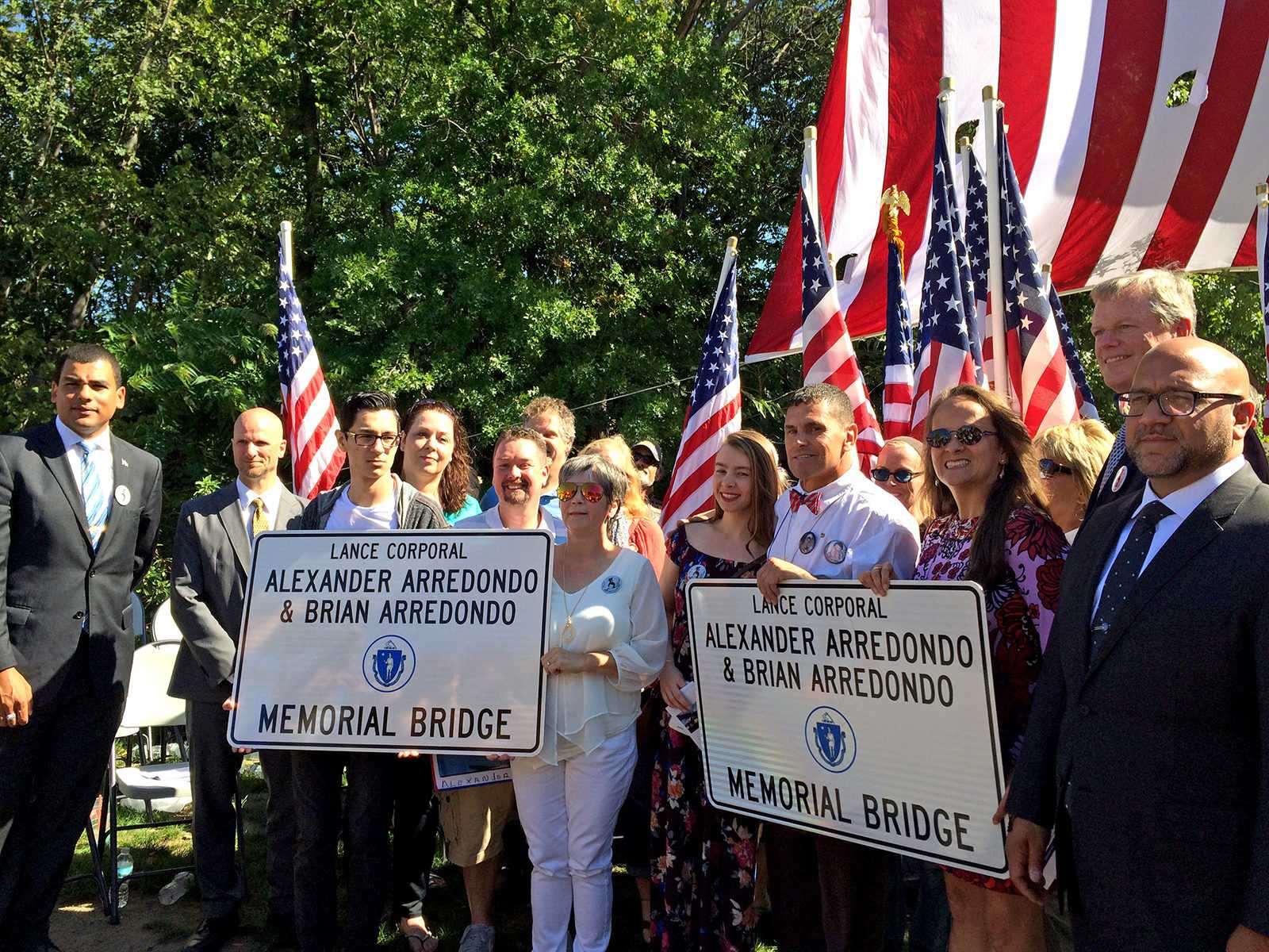 Gov. Charlie Baker joins Boston Marathon bombing hero Carlos Arredondo in Jamaica Plain as the Jamaica Way Bridge over Route 9 is renamed after Arredondo’s late sons. PHOTO BY ALANA FIALKOFF/ DAILY FREE PRESS STAFF