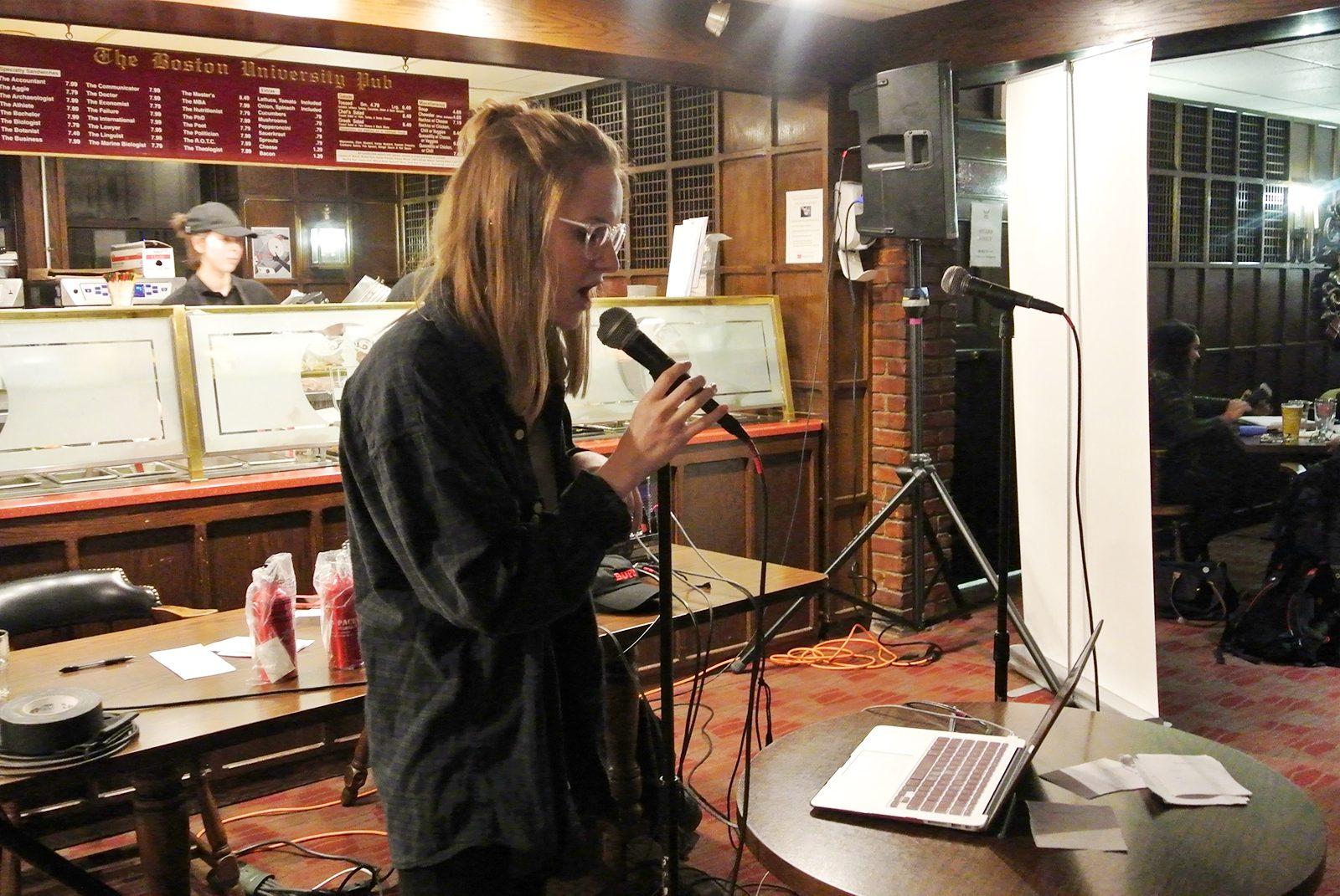 Officers from the Boston University Police Department connect with BU students during a karaoke night Tuesday at BU Pub. PHOTO BY MARIA CASTILLO/ DAILY FREE PRESS STAFF