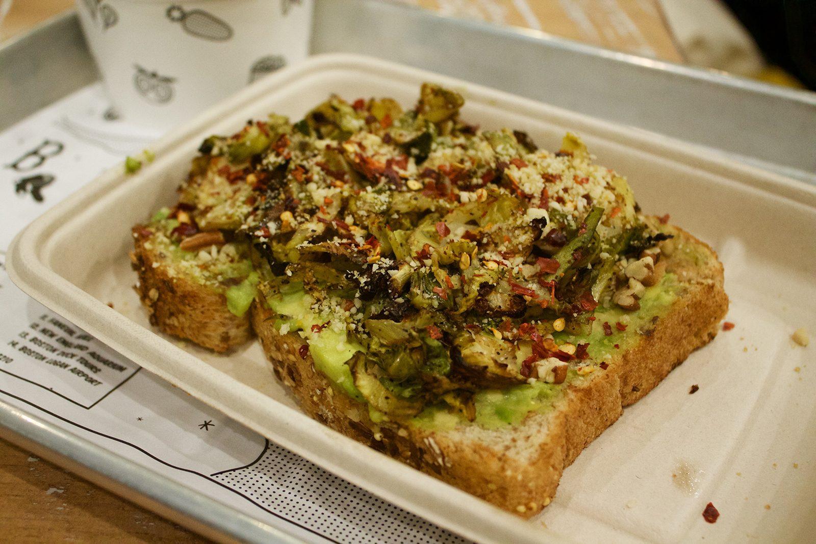 By CHLOE. revamps the classic avocado toast with Brussels sprouts and a sprinkling of spices atop a piece of seasonal seven-grain toast. PHOTO BY CANDICE LIM/ DAILY FREE PRESS STAFF