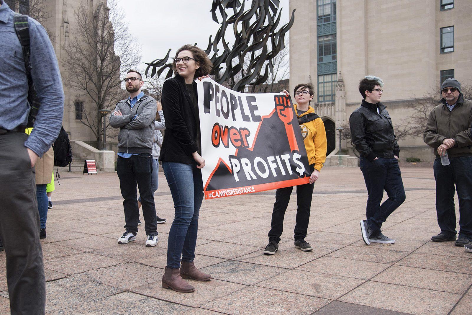 Protesters gather at Marsh Plaza on the afternoon of March 1 to fight recent domestic and foreign actions taken by President Donald Trump’s administration. PHOTO BY LEXI PLINE/ DAILY FREE PRESS STAFF
