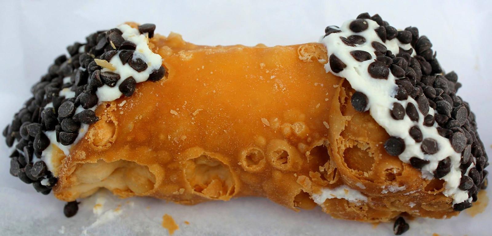 Daniele Bocchieri and Nikolai Romanov, Northeastern University students, started “Sapori Pinocchios,” a business that allows them to ride around their campus and downtown Boston on bikes delivering and selling Italian pastries from the North End. PHOTO BY OLIVIA NADEL/DFP FILE PHOTO