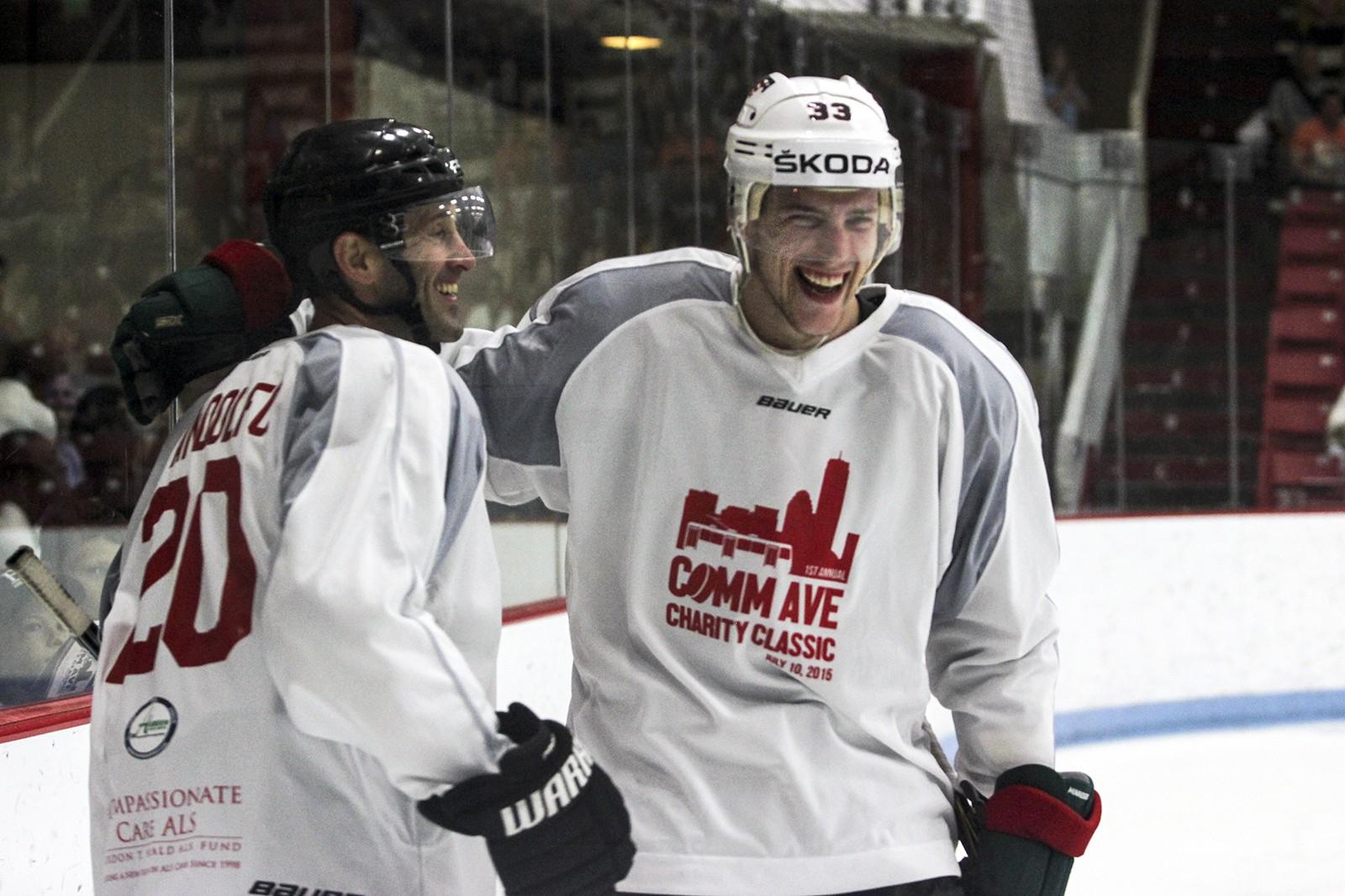 BU's Jay Pandolfo and Charlie Coyle celebrate a goal during the Comm Ave Charity Classic on Friday.