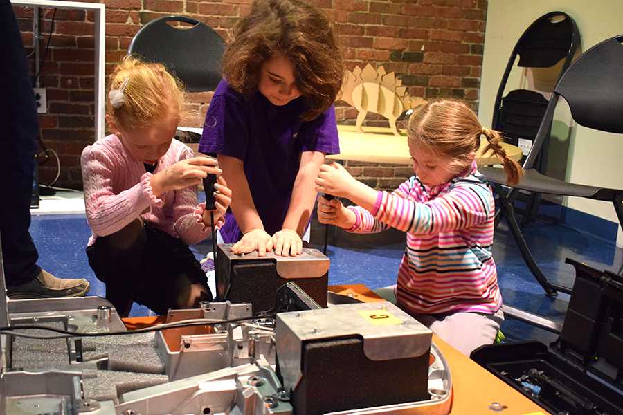 Children work on a robot during “Build-A-Bot with Amazon Robotics” on Saturday. The event was held at the Boston Children’s Museum. PHOTO BY LILLIAN LI/DAILY FREE PRESS STAFF
