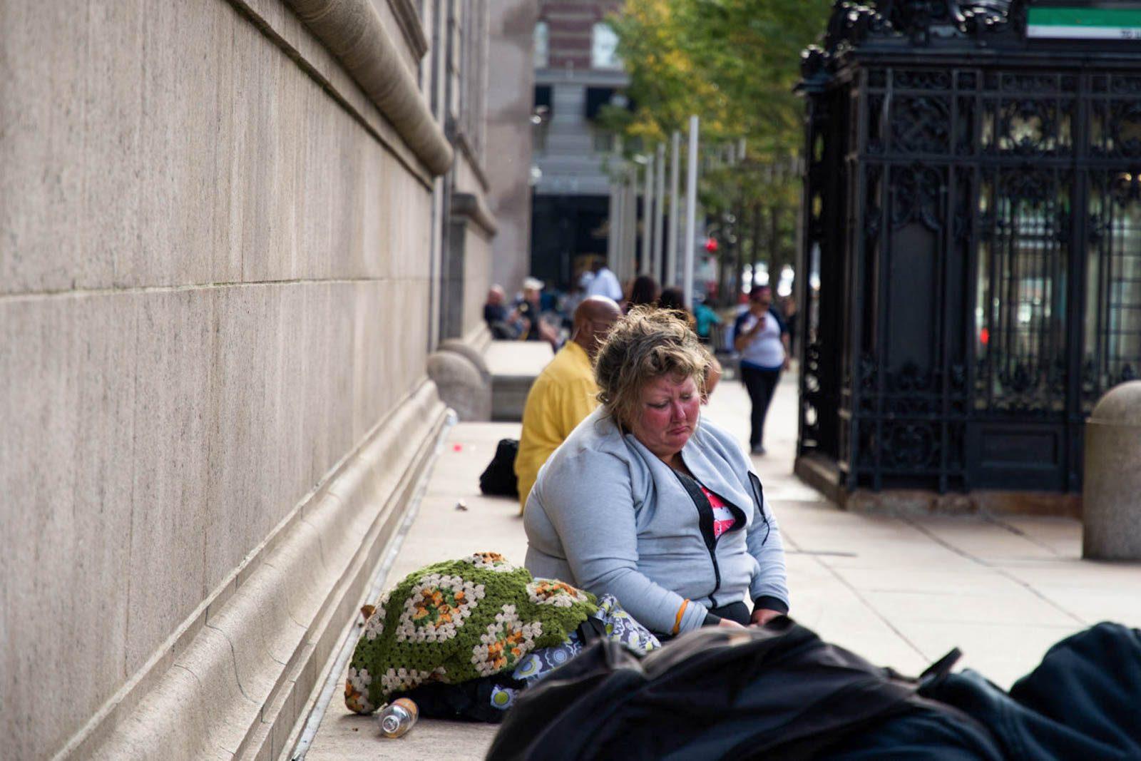 A homeless woman outside the Boston Public Library. The City of Boston announced a four-month initiative to combat youth homelessness on Friday. PHOTO BY CHLOE GRINBERG/DFP FILE PHOTO


