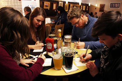 Bostonians gather at Trident Booksellers and Cafe to write to local representatives and have their voice heard. PHOTO BY COLE SCHONEMAN/ DAILY FREE PRESS CONTRIBUTOR