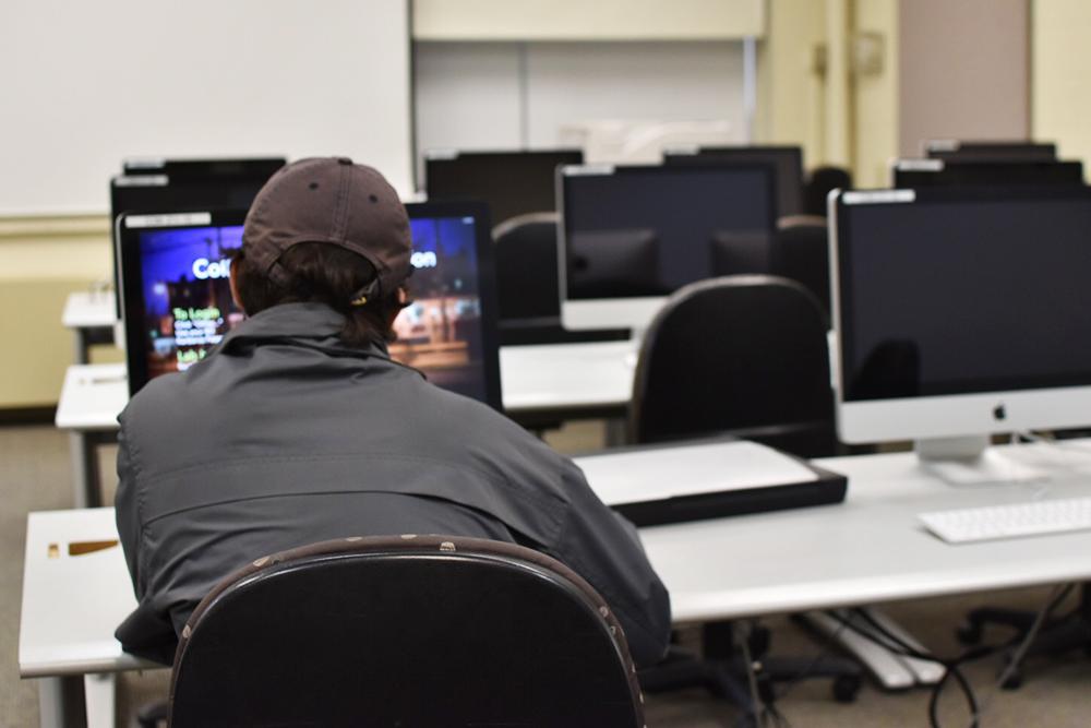 A student works in a COM computer lab. COM will be getting rid of many of the computers in the COM building next year. PHOTO BY VIOLET GIDDINGS/DAILY FREE PRESS STAFF