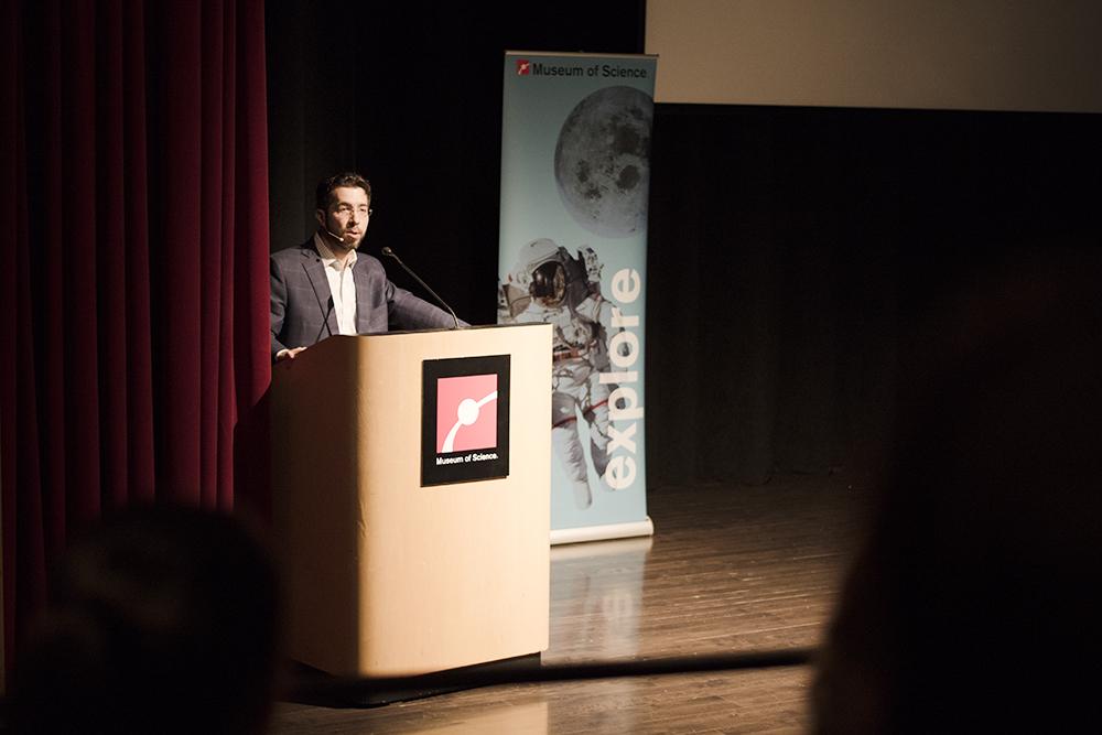 Dr. Nir Grossman speaks during “Cyborgs, Futurists &amp; Transhumanism.” The event was held at the Boston Museum of Science on March 28. PHOTO BY MAISIE MANSFIELD-GREENWALD/DAILY FREE PRESS STAFF
