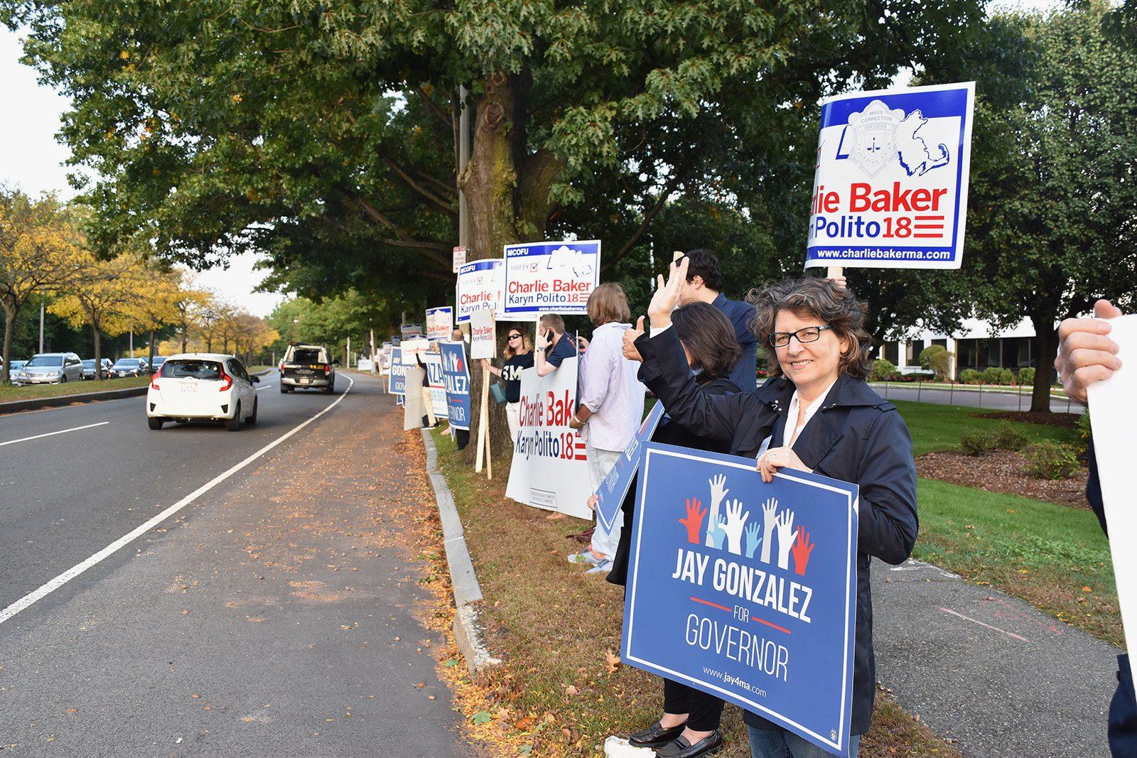 Campaign volunteers canvas outside WBZ Studios in Allston Tuesday evening during the first Massachusetts gubernatorial debate between incumbent Charlie Baker, a Republican, and challenger Jay Gonzalez, a Democrat. ZOE ADES/ DAILY FREE PRESS STAFF