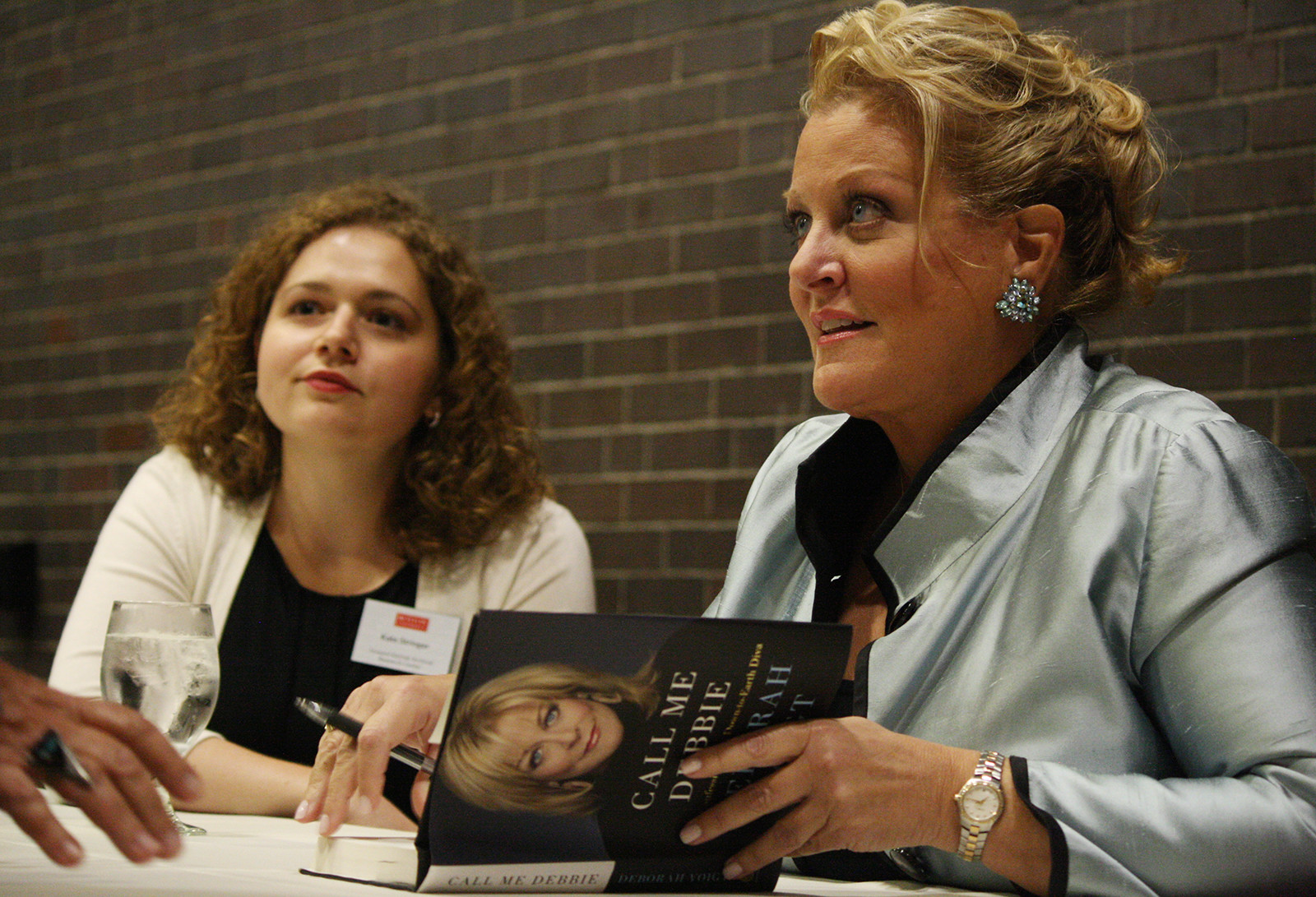 Soprano songstress Deborah Voigt signs a fan's copy of her new memoir, "Call Me Debbie: True Confessions of a Down-to-Earth Diva," following her talk at Metcalf Auditorium Tuesday night as part of the Howard Gotlieb Archival Research Center Friends Speaker Series. PHOTO BY ADRIANA DIAZ/DAILY FREE PRESS CONTRIBUTOR 