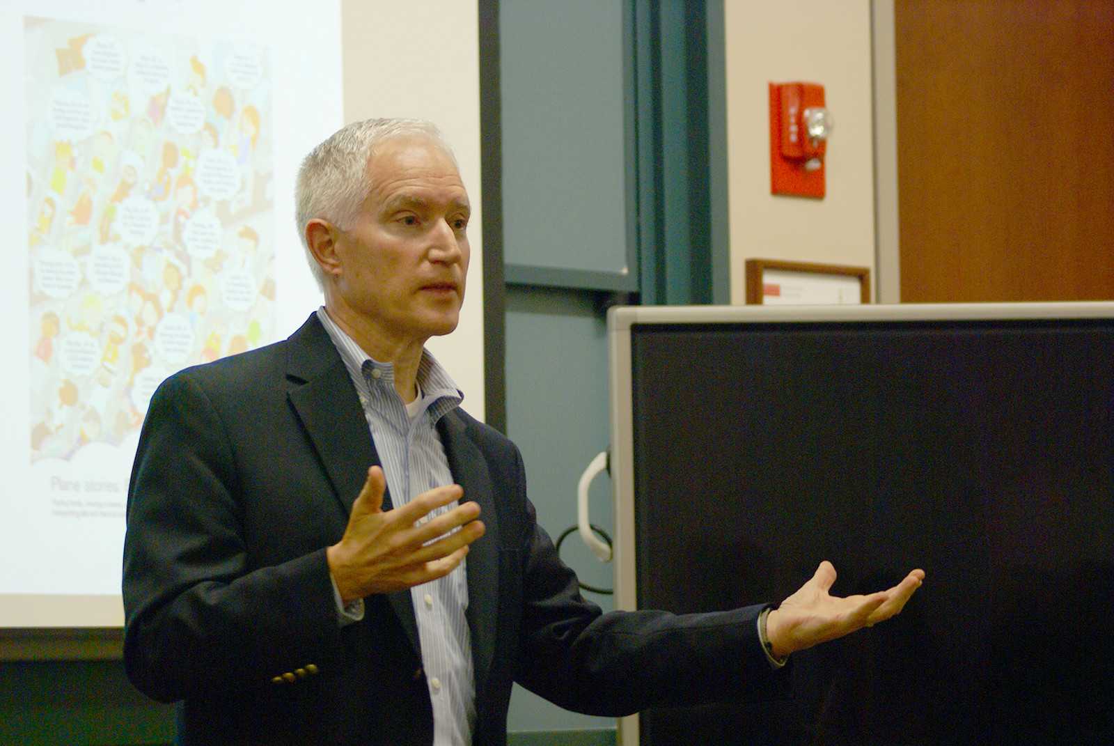 The Delta Airlines General Manager of Environmental Sustainability, Steve Tochilin, speaks to attendees at the Questrom School of Business Wednesday night. PHOTO BY JAKE FRIEDLAND/DAILY FREE PRESS STAFF