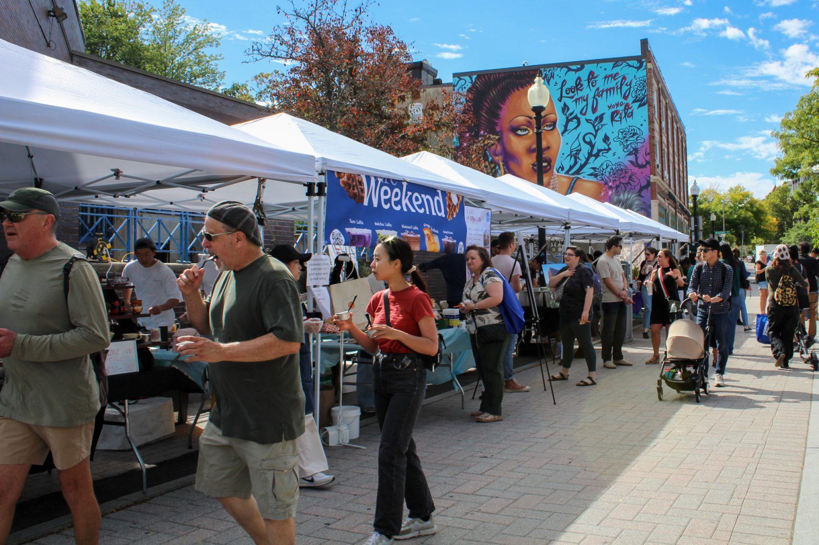 People walking around the Taste of Allston festival on Saturday. The festival aims to spotlight local Allston restaurants and businesses. ISABELLA OLAND/DFP PHOTOGRAPHER