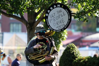 babam musician plays a tuba at an aclu march