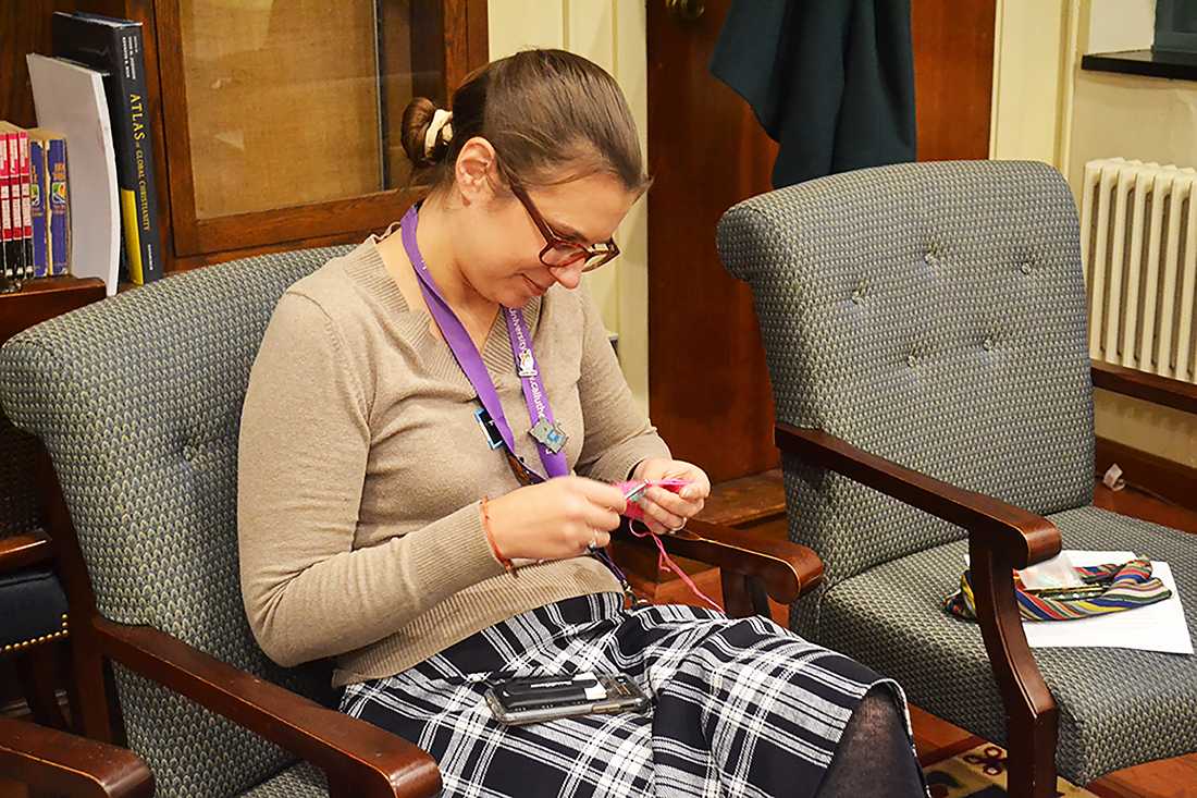 Boston University Chaplain for International Students Jessica Chika knits during a Create Space session at Marsh Chapel on Tuesday. CAROLINE FERNANDEZ/ DAILY FREE PRESS STAFF