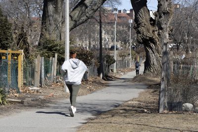 jogger runs through the back bay fens in boston