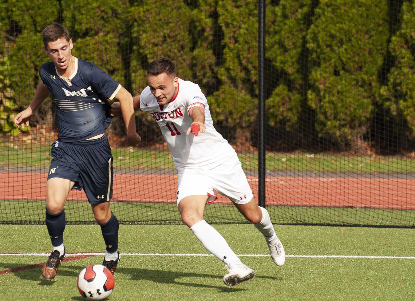 kari petursson fights for the ball against navy at nickerson field