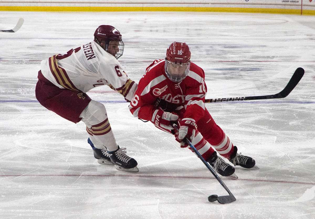 Boston University Forward Robert Mastrosimone moving the puck against Boston College