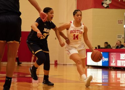 sydney johnson drives against a navy defender