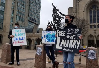 young democratic socialists of america protesters hold signs in support of free laundry at boston university