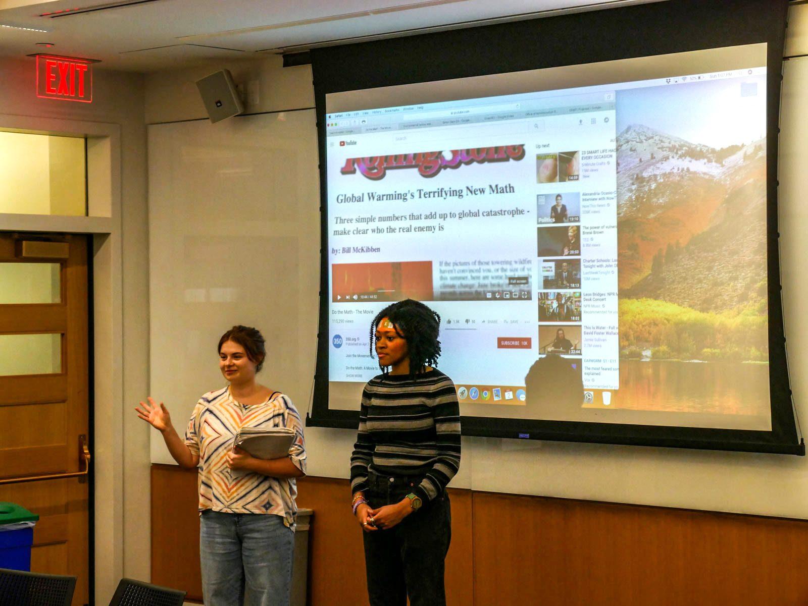 Divest BU members Anna Baggett (left) and Bolaji Olagbegi (right), both juniors in CAS, speak at a teach-in on environmental justice Sunday afternoon. FELIX PHILLIPS/ DAILY FREE PRESS STAFF
