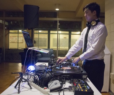 DJ Fried Rice, also known as Questrom School of Business freshman Ryan Ng, prepares to spin a set at the Catholic Center Spring Formal Friday night at The Towers. PHOTO BY KELSEY CRONIN/DAILY FREE PRESS STAFF