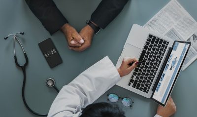 doctor shows test results to a patient