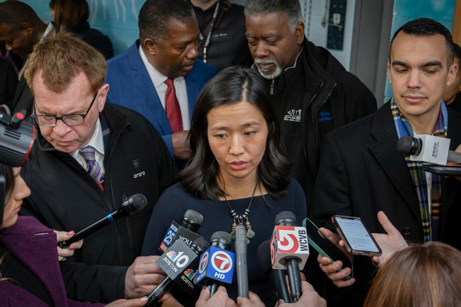 Boston Mayor Michelle Wu speaks to reporters in January. Local politicians, such as Mayor Wu, have been campaigning across the country for either Vice President Kamala Harris or former President Donald Trump, which can make balancing local and national issues a challenge. MATTHEW EADIE/DFP PHOTOGRAPHER